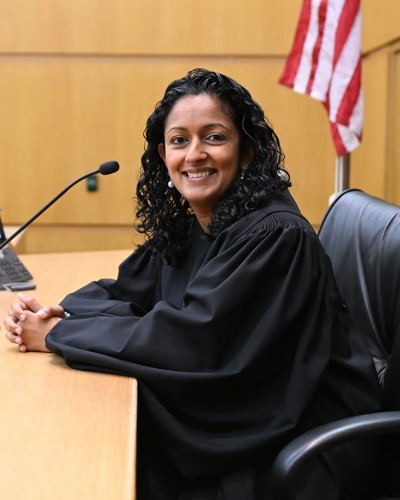 Judge Sparkle L. Sooknanan sitting at her bench in her judge's robes